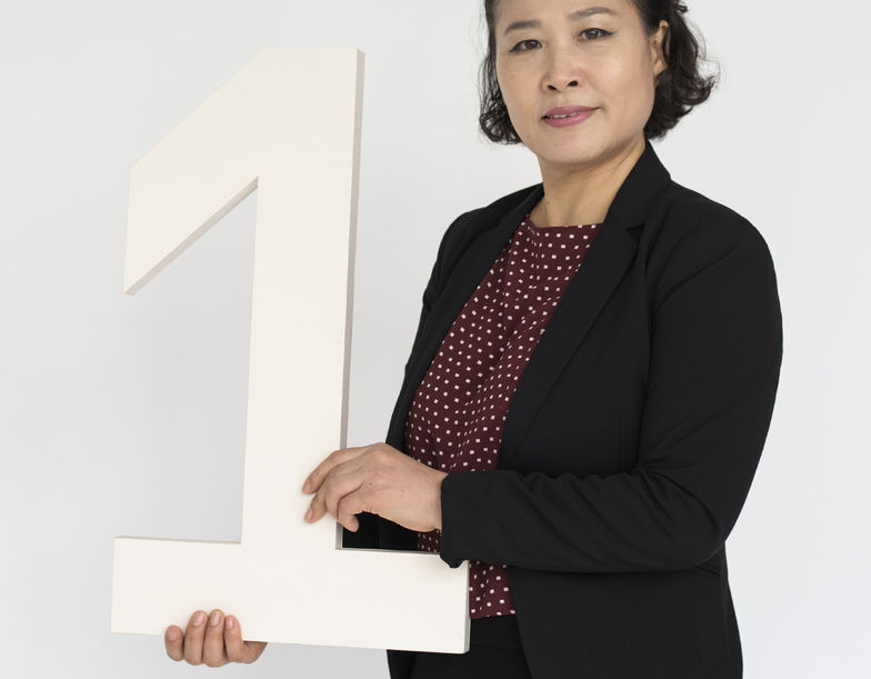 Woman holding number 1